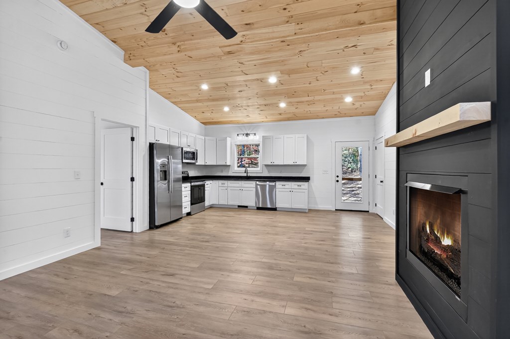 85 Duck Cove Morganton, GA 30560 - Photo 10 of 36 a view of a kitchen with stainless steel appliances kitchen island wooden floor and chandelier