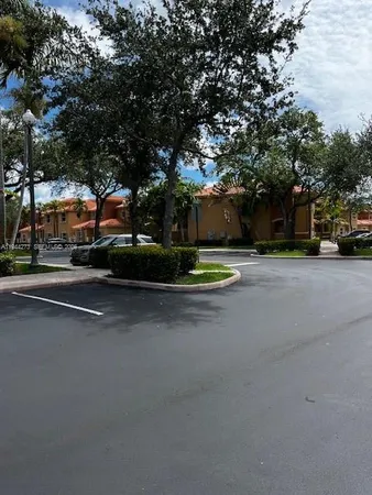 a view of street with parked cars