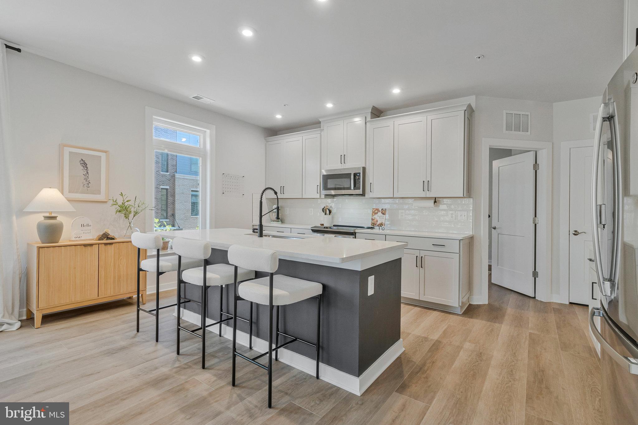 1669 Bandit Loop, Unit 209A Reston, VA 20190 - Photo 7 of 61 Quartz countertops - Custom Cabinets