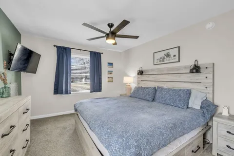 a bedroom with a large bed and a window