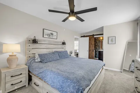 a bedroom with a bed and a walk in closet