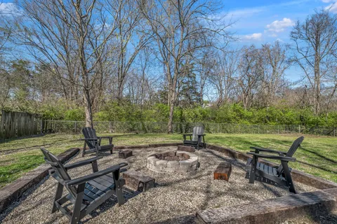 a view of a bench in a backyard
