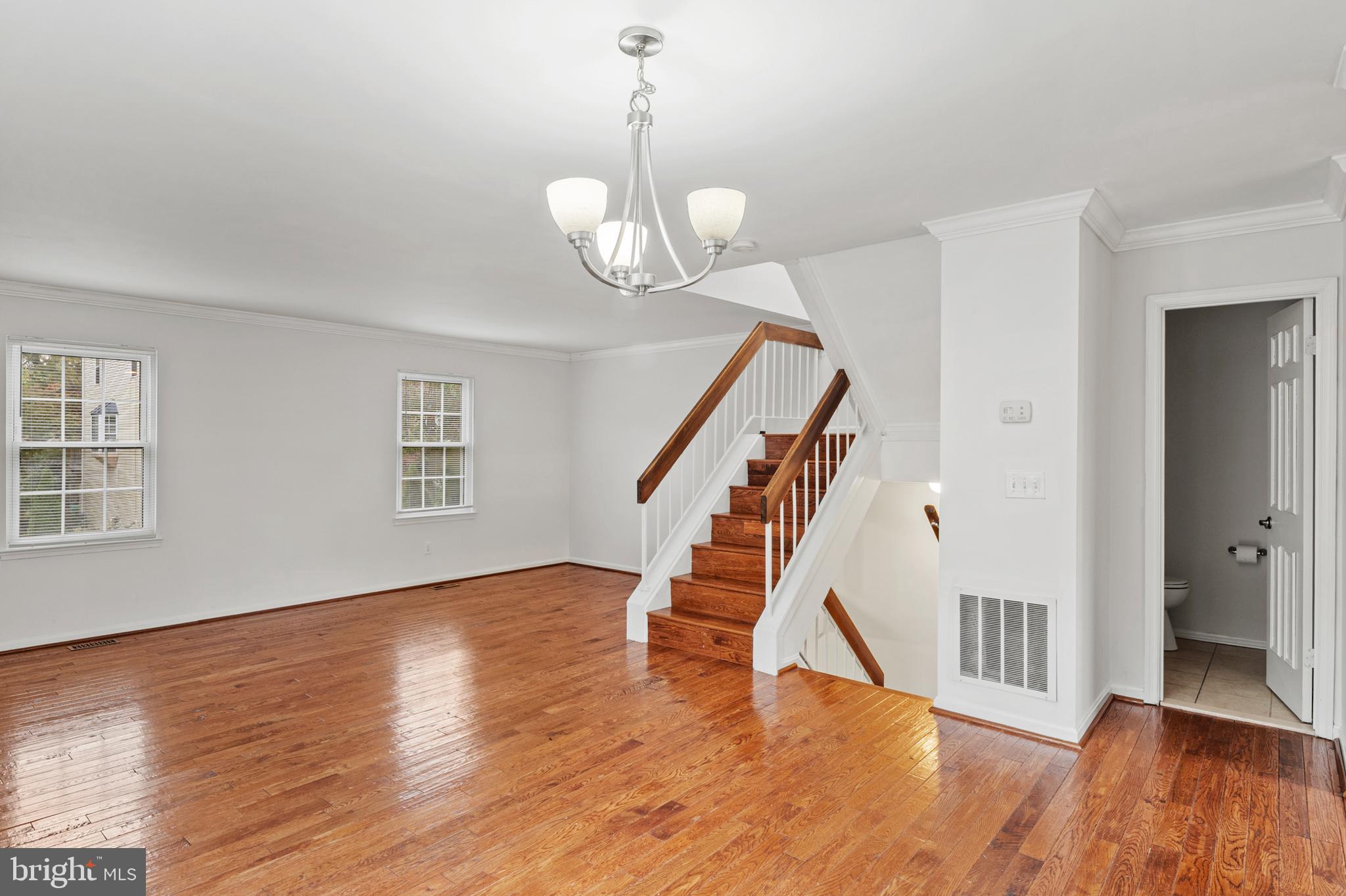 7022 Storch Lane Lanham, MD 20706 - Photo 17 of 44 Spacious dining room w/ elegant chandelier!