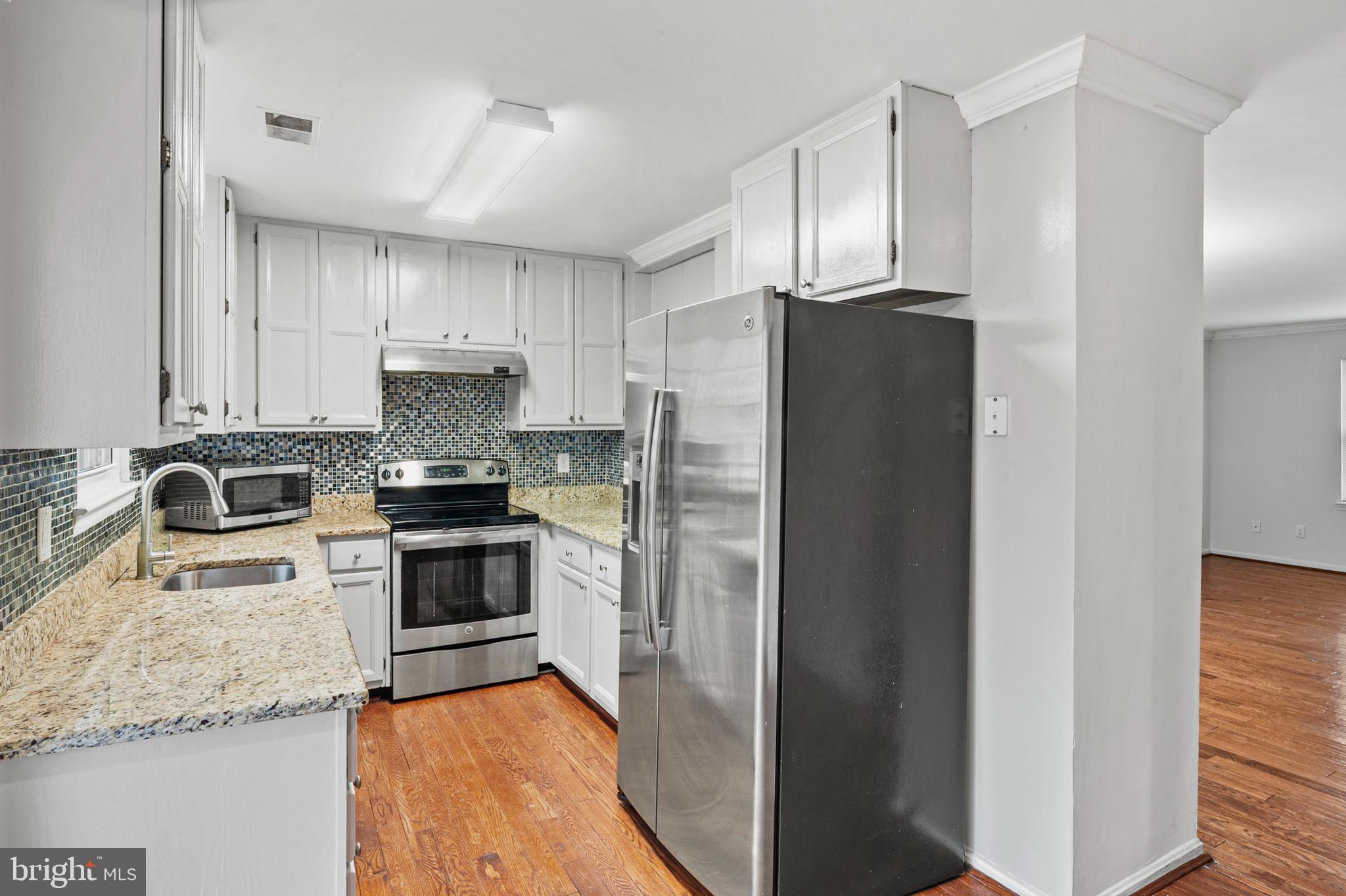 7022 Storch Lane Lanham, MD 20706 - Photo 19 of 44 Lovely kitchen with gleaming hardwoods!