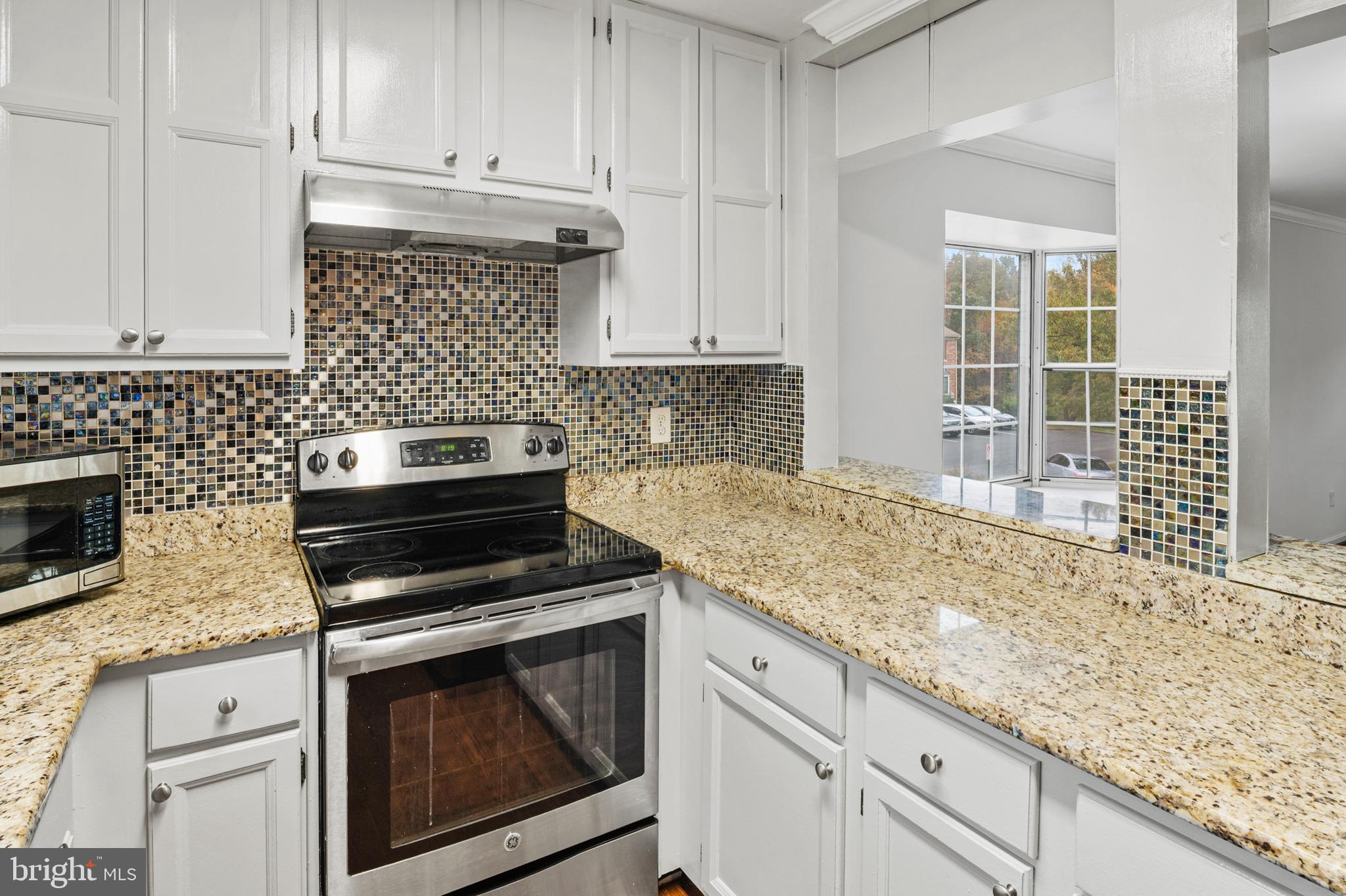 7022 Storch Lane Lanham, MD 20706 - Photo 21 of 44 Kitchen has a "pass-thru" to the dining room!