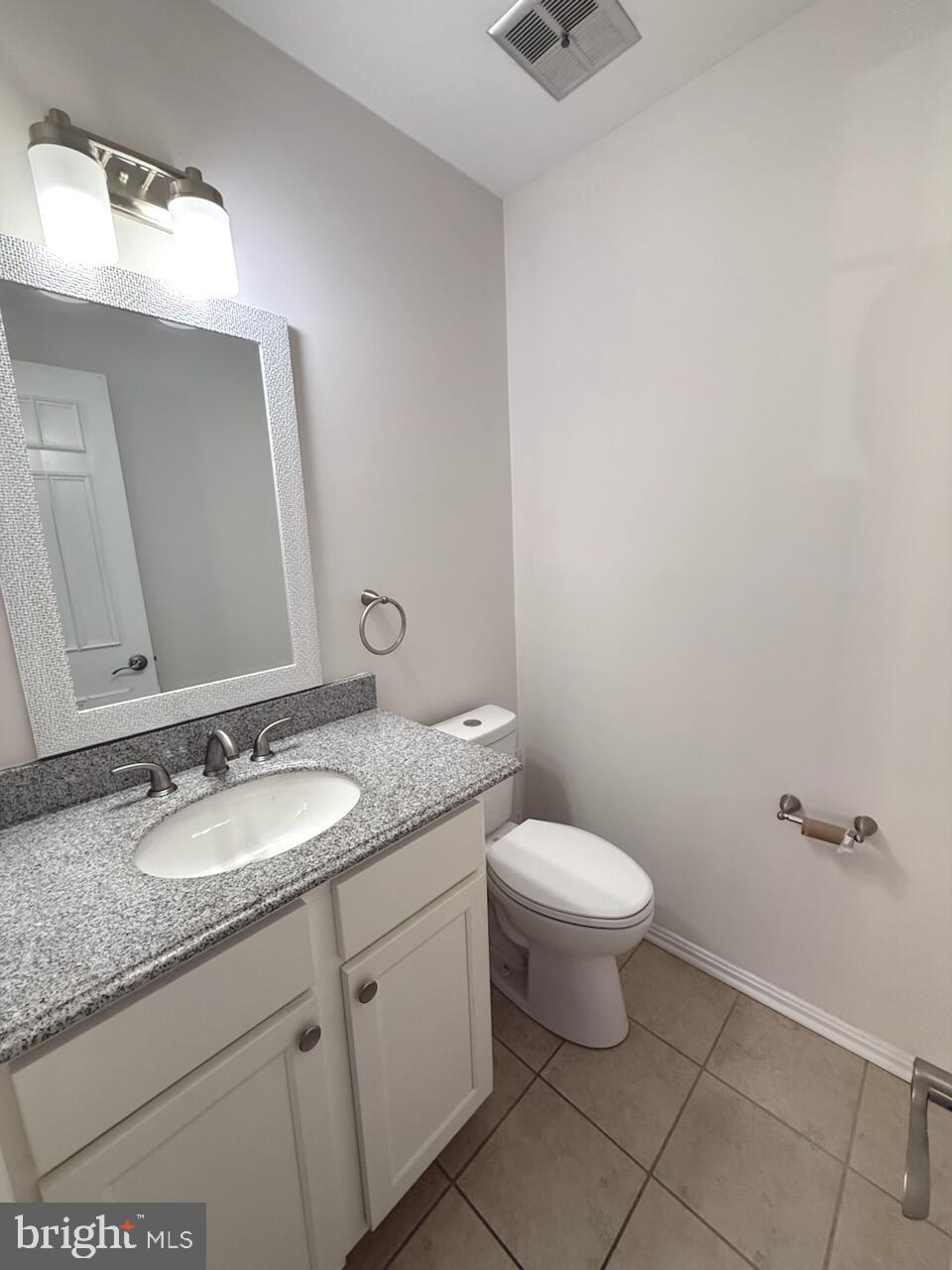 7022 Storch Lane Lanham, MD 20706 - Photo 26 of 44 Convenient half bathroom on the main level.