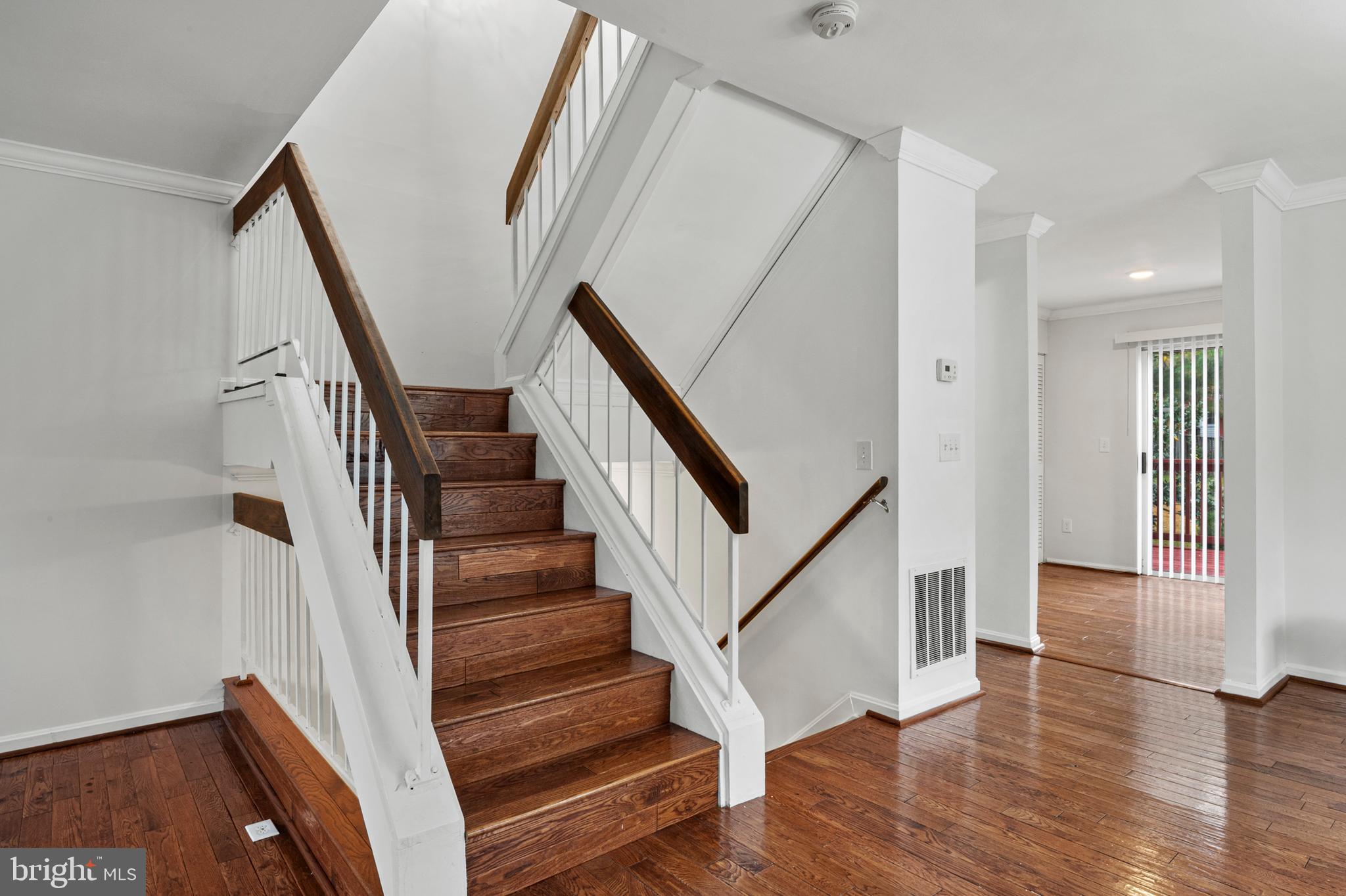 7022 Storch Lane Lanham, MD 20706 - Photo 27 of 44 Stairwell w/ hardwoods leading to the upper level.