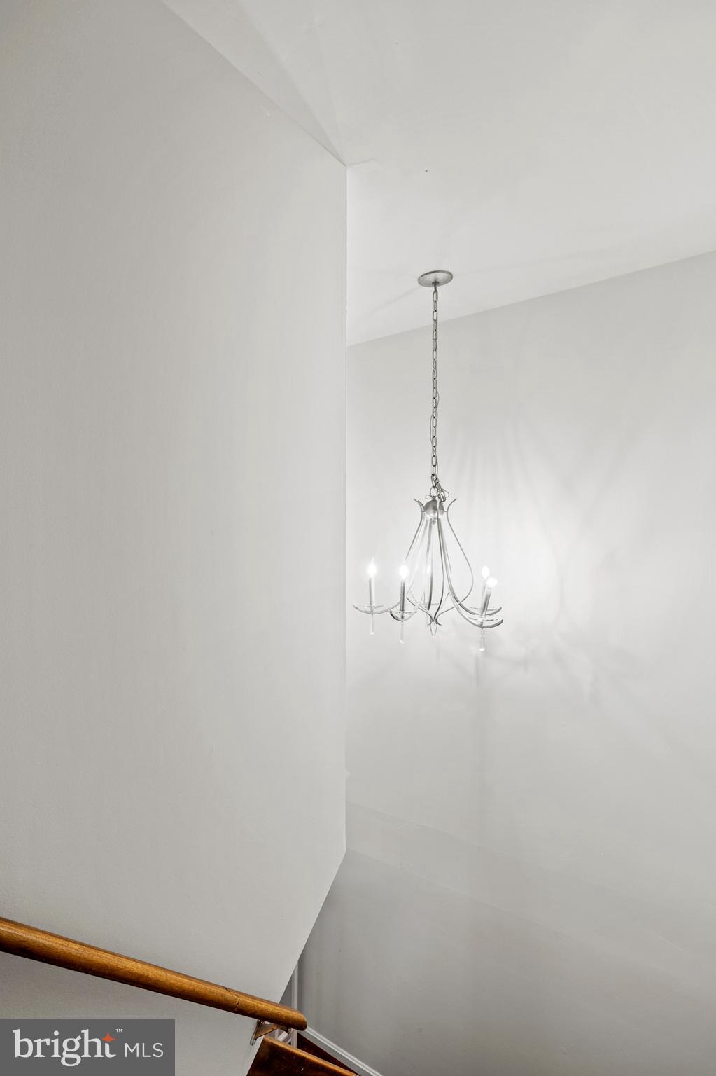 7022 Storch Lane Lanham, MD 20706 - Photo 40 of 44 Upper level stairwell with elegant chandelier!