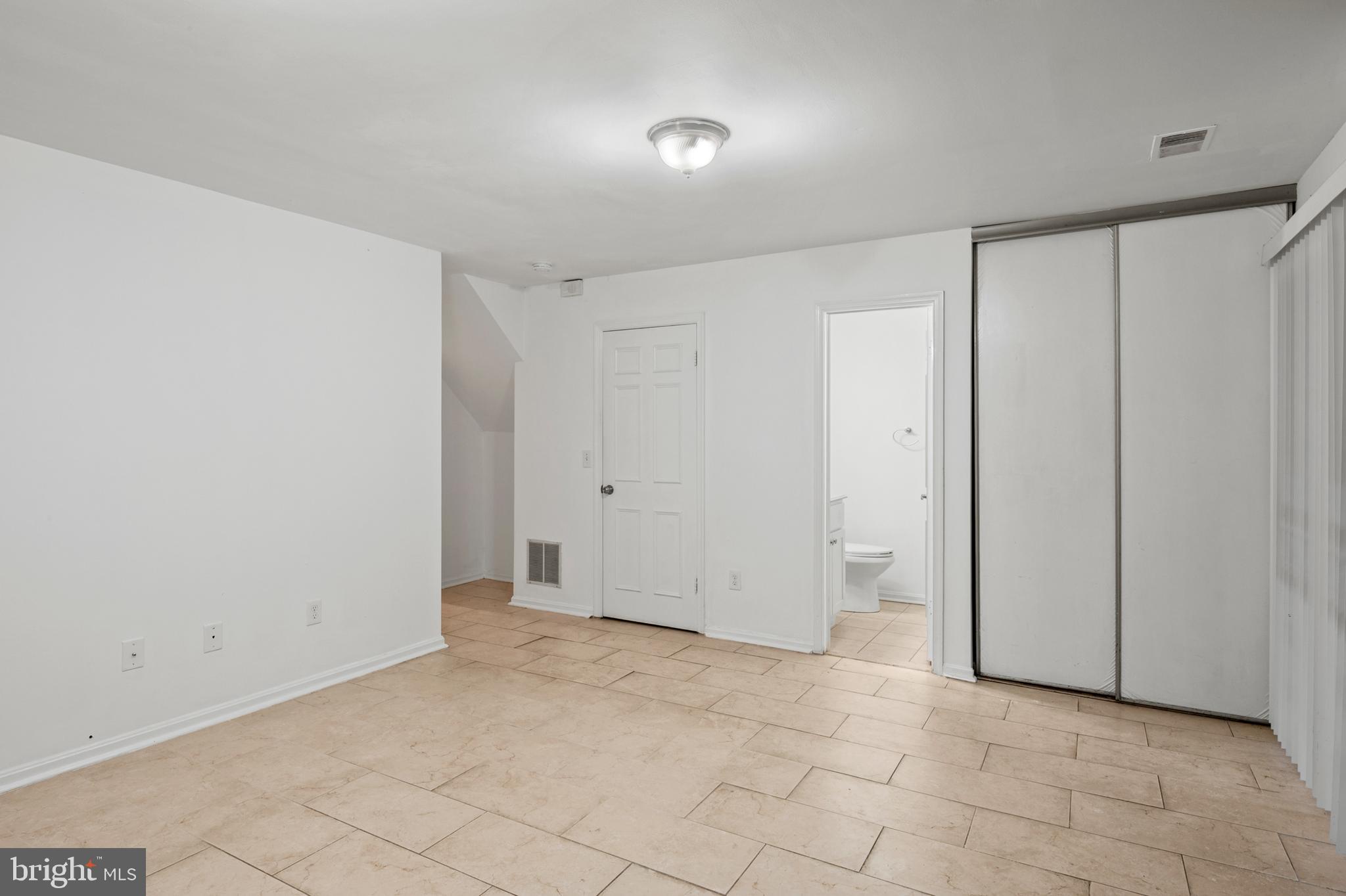 7022 Storch Lane Lanham, MD 20706 - Photo 6 of 44 Basement rec. room also has ceramic tile floors!