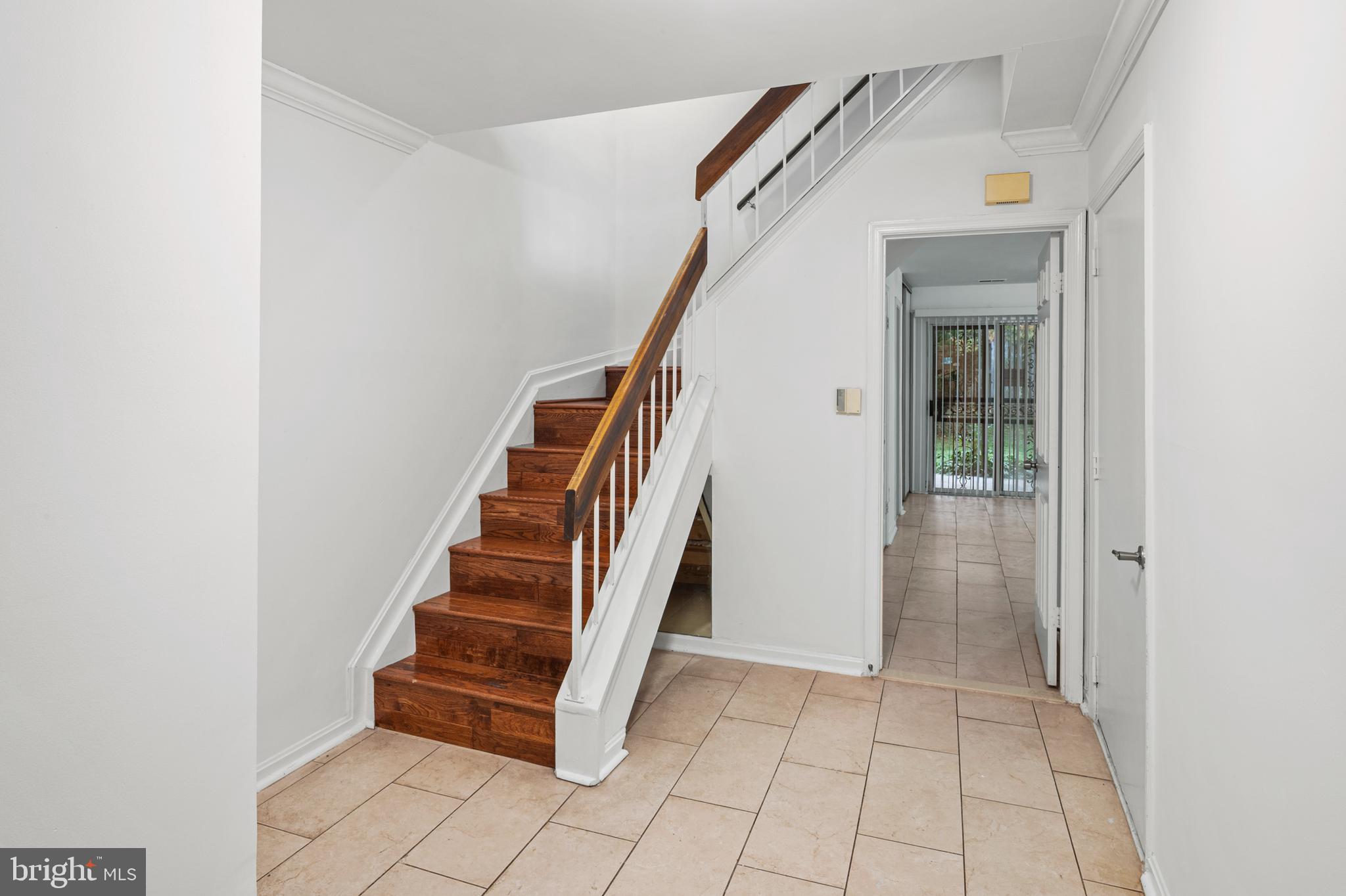 7022 Storch Lane Lanham, MD 20706 - Photo 9 of 44 Ceramic tile foyer & stairwell to main level.
