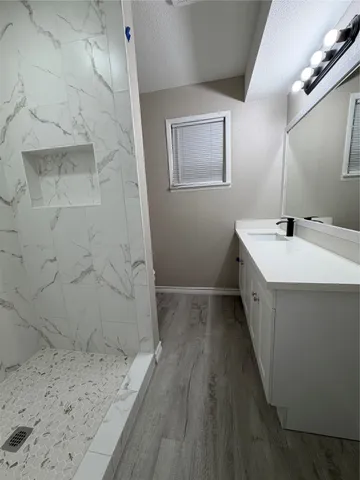 a bathroom with a sink and a mirror