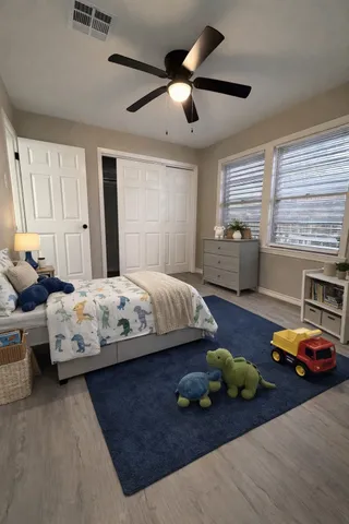 a bedroom with bed and window