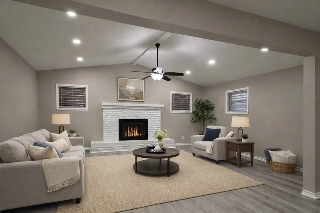 a living room with furniture and a fireplace