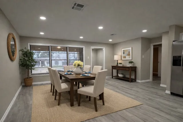 a view of a dining room with furniture and a wooden floor