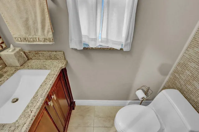 a bathroom with a sink and toilet