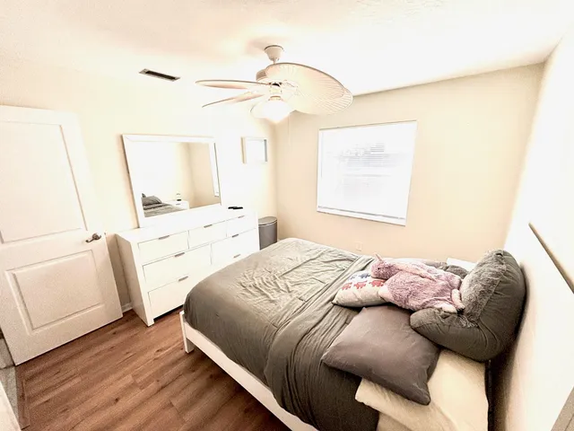 a bedroom with a bed and a couch
