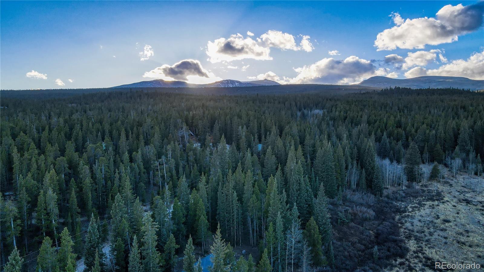 242 Pine Ridge Road Alma, CO 80420 - Photo 29 of 42 a view of a lake in middle of forest