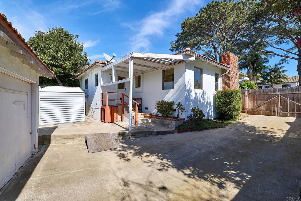 920 Stratford Drive Encinitas, CA 92024 - Photo 21 of 57 a front view of a house with a yard and garage