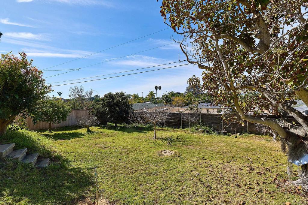 920 Stratford Drive Encinitas, CA 92024 - Photo 25 of 57 a view of a large pool with lawn chairs under an umbrella