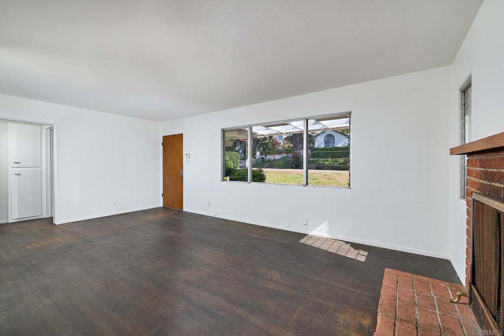920 Stratford Drive Encinitas, CA 92024 - Photo 4 of 57 an empty room with wooden floor and windows