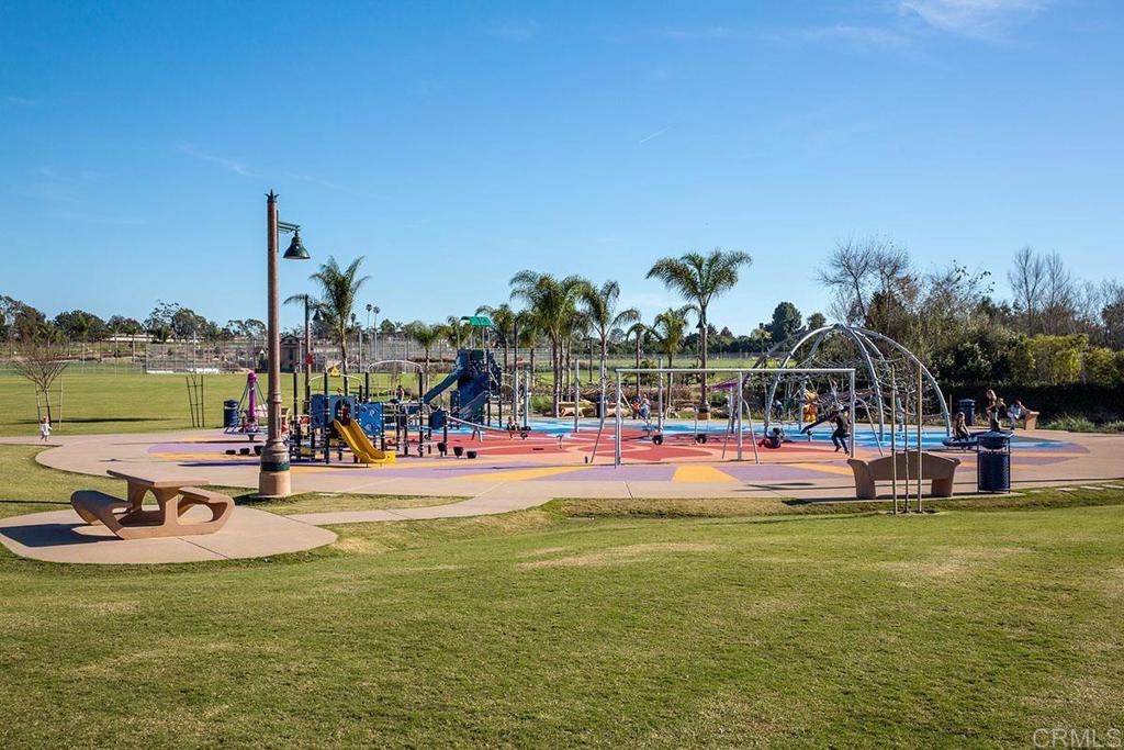 920 Stratford Drive Encinitas, CA 92024 - Photo 50 of 57 a view of a swimming pool with a lawn chairs and plants