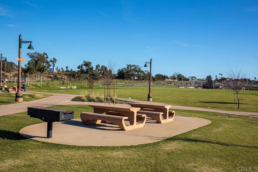 920 Stratford Drive Encinitas, CA 92024 - Photo 51 of 57 a view of a swimming pool with a table and chairs