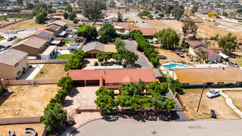 an aerial view of residential houses with outdoor space