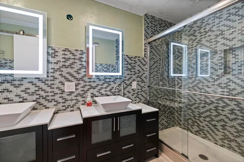 a bedroom with bed and a flat screen tv