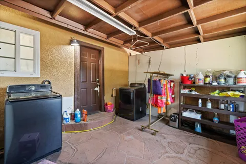 a kitchen with stainless steel appliances granite countertop a sink and cabinets