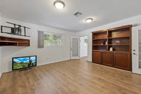 a room with gym equipment and a large window