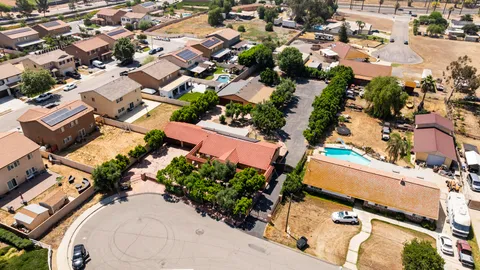 an aerial view of residential houses with outdoor space