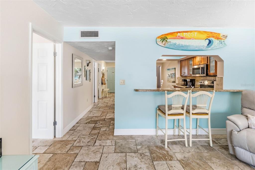 6500 Midnight Pass Road, Unit 208 Sarasota, FL 34242 - Photo 11 of 36 a view of a livingroom with furniture and a ceiling fan