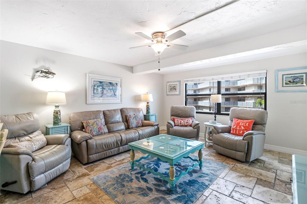 6500 Midnight Pass Road, Unit 208 Sarasota, FL 34242 - Photo 13 of 36 a living room with furniture and a rug
