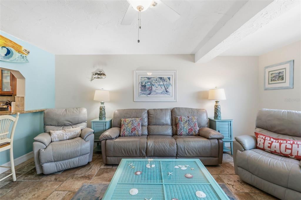 6500 Midnight Pass Road, Unit 208 Sarasota, FL 34242 - Photo 14 of 36 a living room with furniture and a couch