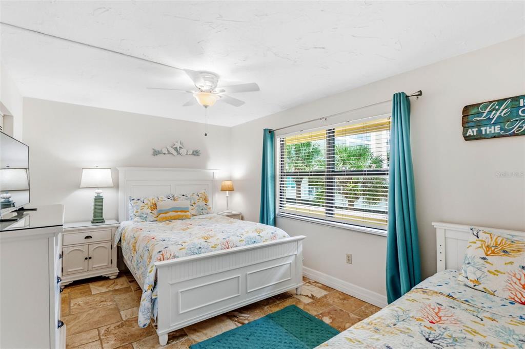 6500 Midnight Pass Road, Unit 208 Sarasota, FL 34242 - Photo 19 of 36 a bedroom with a bed and a window