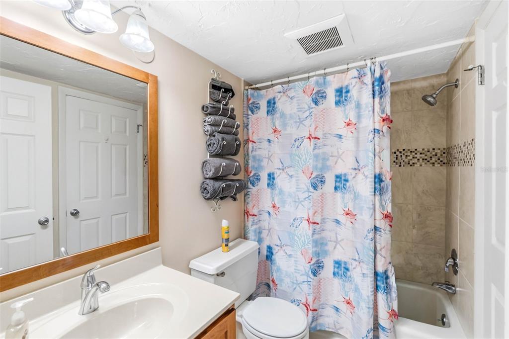 6500 Midnight Pass Road, Unit 208 Sarasota, FL 34242 - Photo 21 of 36 a bathroom with a sink toilet and shower