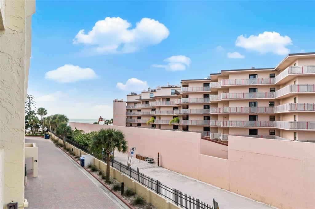 6500 Midnight Pass Road, Unit 208 Sarasota, FL 34242 - Photo 24 of 36 a view of building with balcony