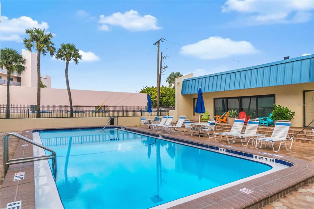 6500 Midnight Pass Road, Unit 208 Sarasota, FL 34242 - Photo 25 of 36 a view of swimming pool with outdoor seating