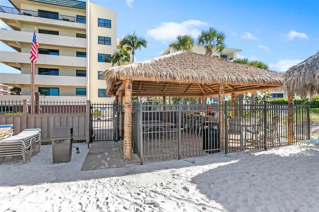 6500 Midnight Pass Road, Unit 208 Sarasota, FL 34242 - Photo 29 of 36 a backyard of a house with table and chairs