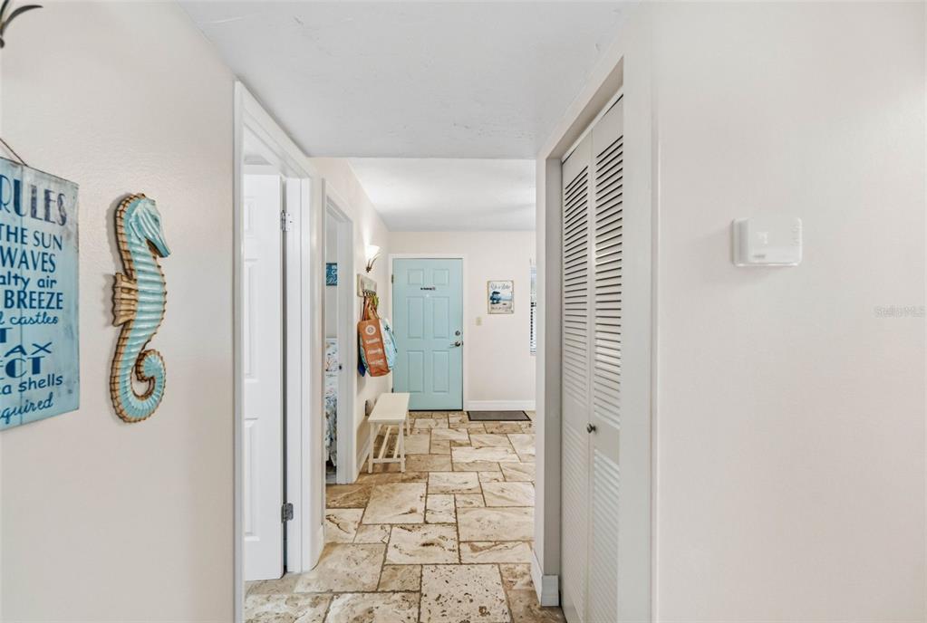 6500 Midnight Pass Road, Unit 208 Sarasota, FL 34242 - Photo 3 of 36 a view of a hallway with entryway and front door