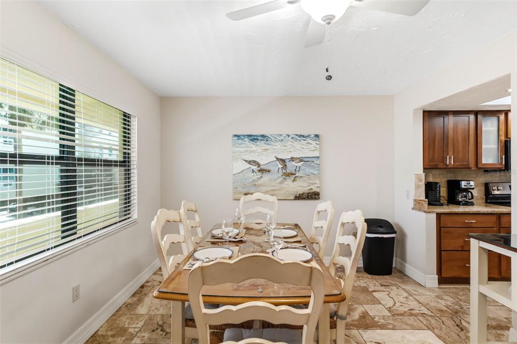 6500 Midnight Pass Road, Unit 208 Sarasota, FL 34242 - Photo 6 of 36 a view of a dining room with furniture window and outside view