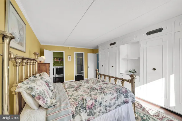 a bed room with a bed and a large mirror