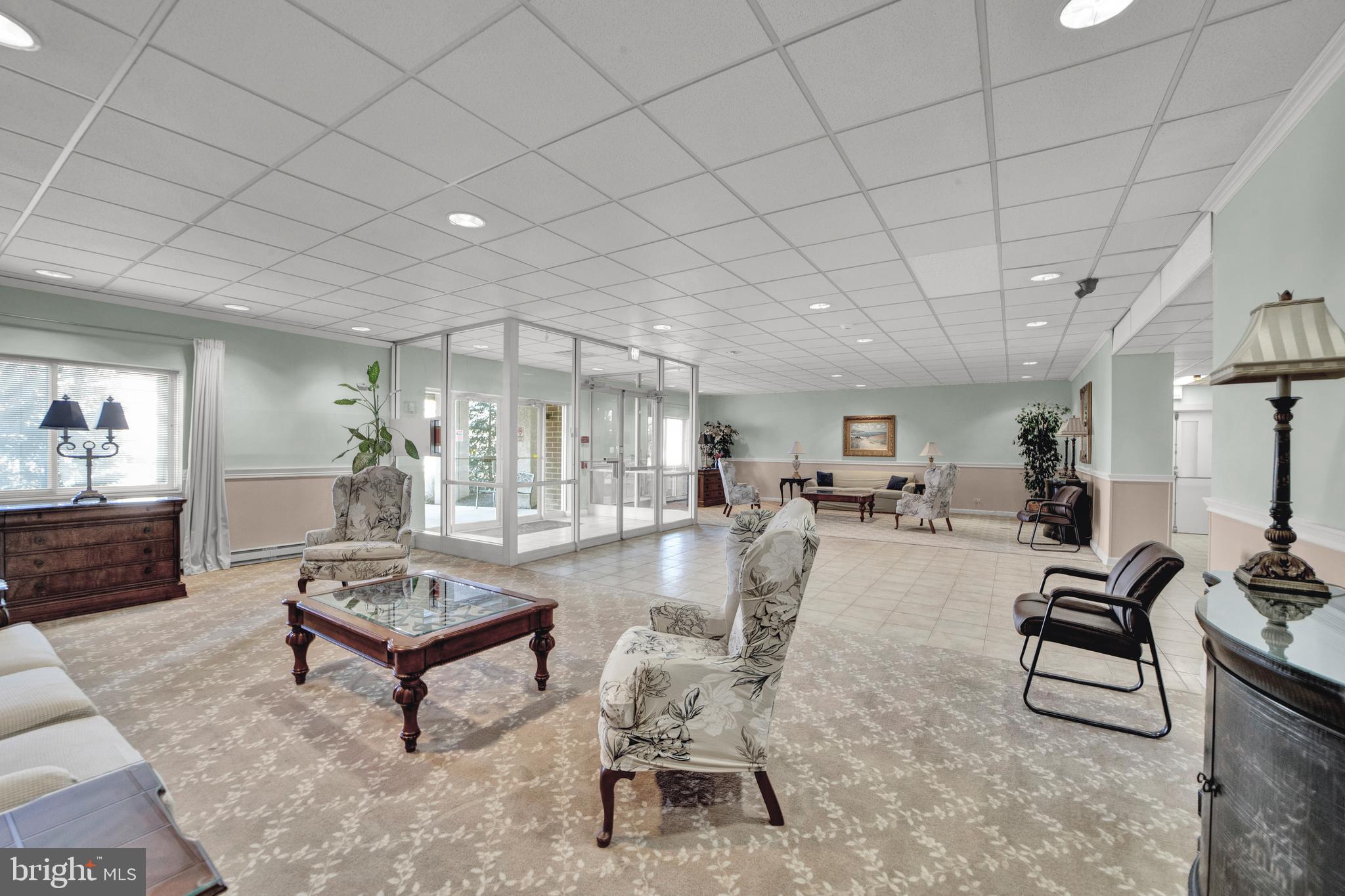 860 Lower Ferry Road, Unit 5P Ewing, NJ 08628 - Photo 24 of 29 a living room with furniture and a table