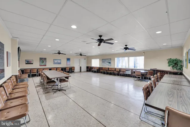 a view of a living room kitchen and dining room