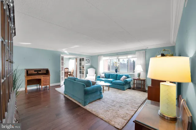 a living room with furniture and a table