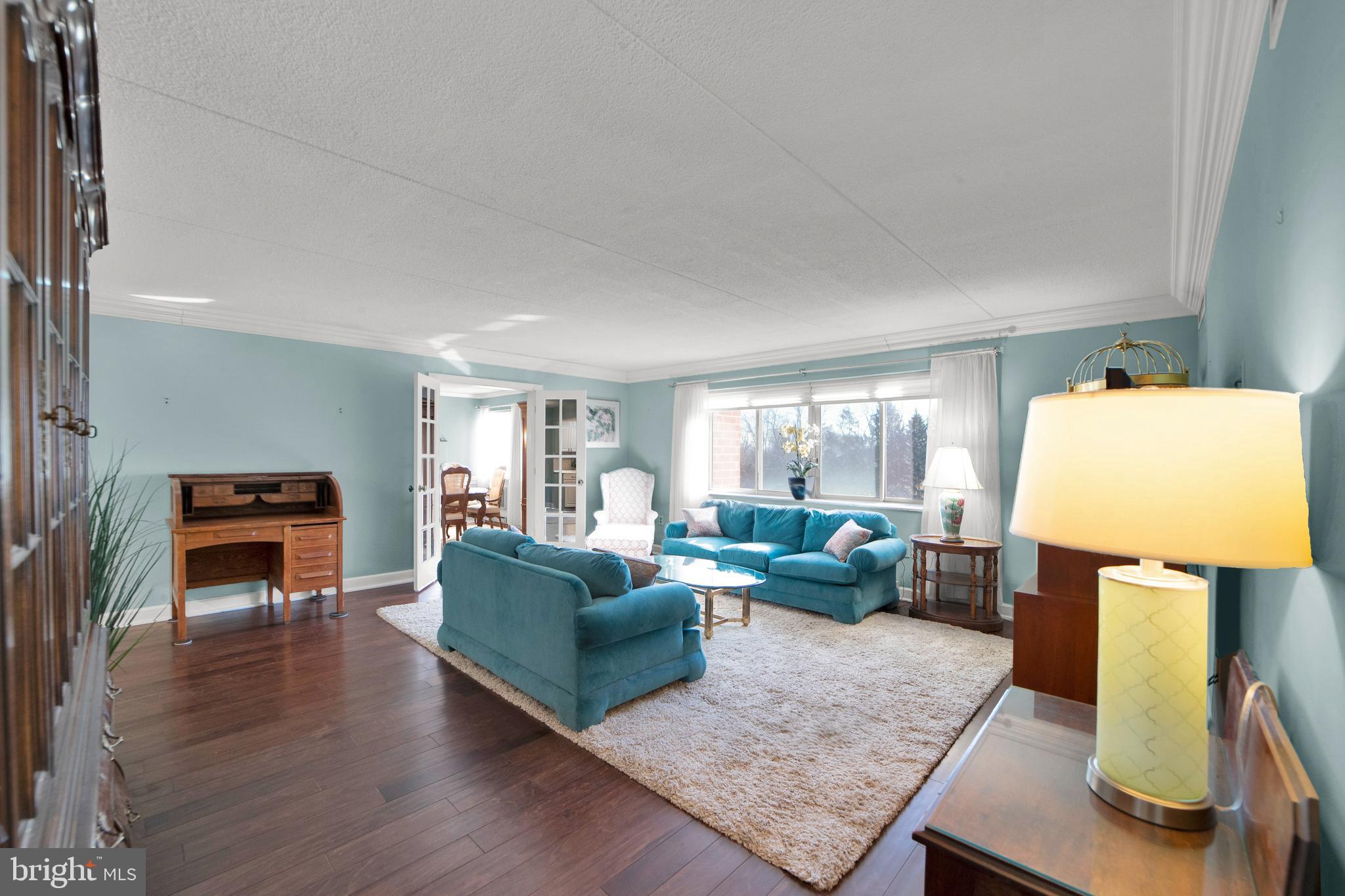860 Lower Ferry Road, Unit 5P Ewing, NJ 08628 - Photo 4 of 29 a living room with furniture and a table