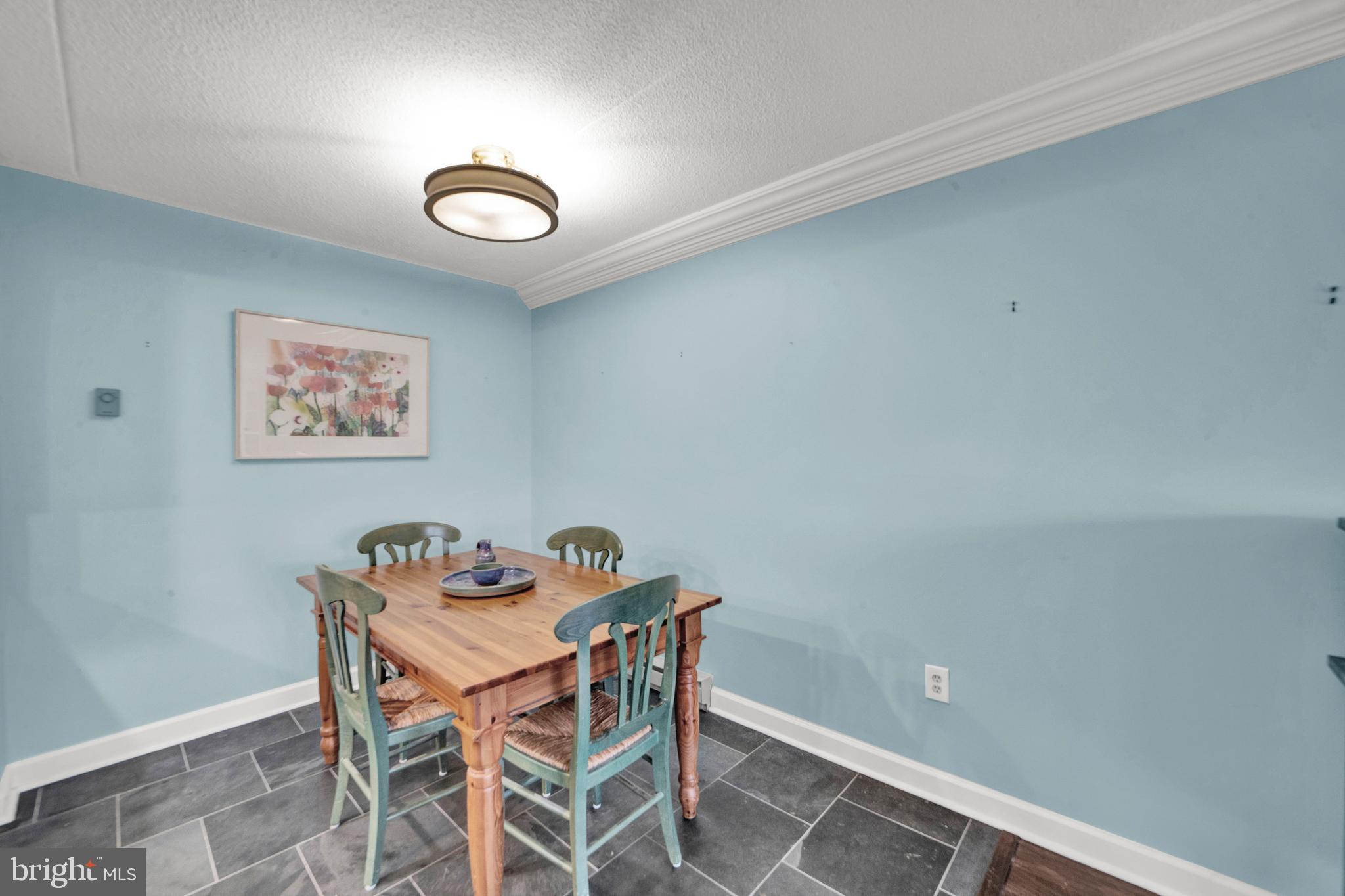 860 Lower Ferry Road, Unit 5P Ewing, NJ 08628 - Photo 9 of 29 a view of a dining room with furniture
