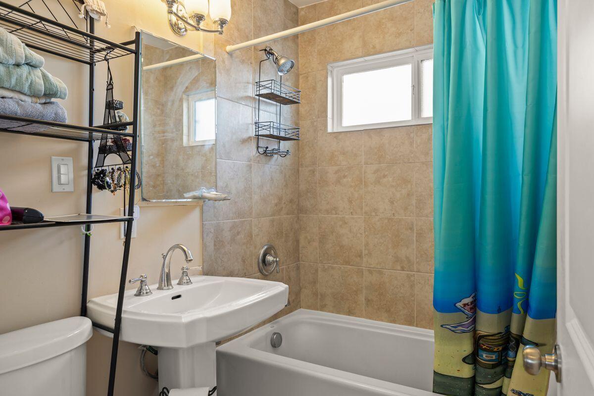 354 West Prospect Street Ventura, CA 93001 - Photo 12 of 41 a bathroom with a sink a toilet and shower