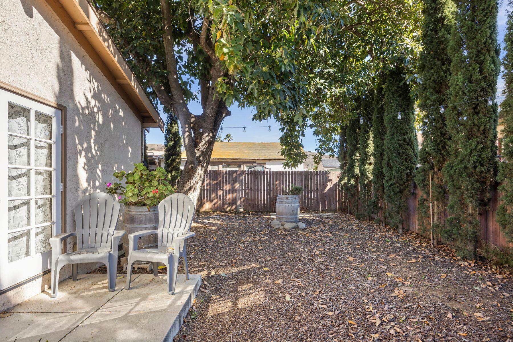 354 West Prospect Street Ventura, CA 93001 - Photo 27 of 41 a view of a chairs and table in backyard