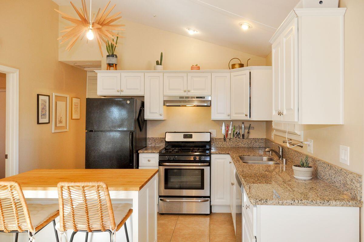 354 West Prospect Street Ventura, CA 93001 - Photo 31 of 41 a kitchen with granite countertop a refrigerator stove top oven and sink